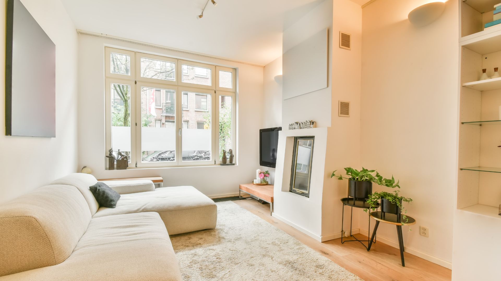 A living room filled with furniture and a fire place