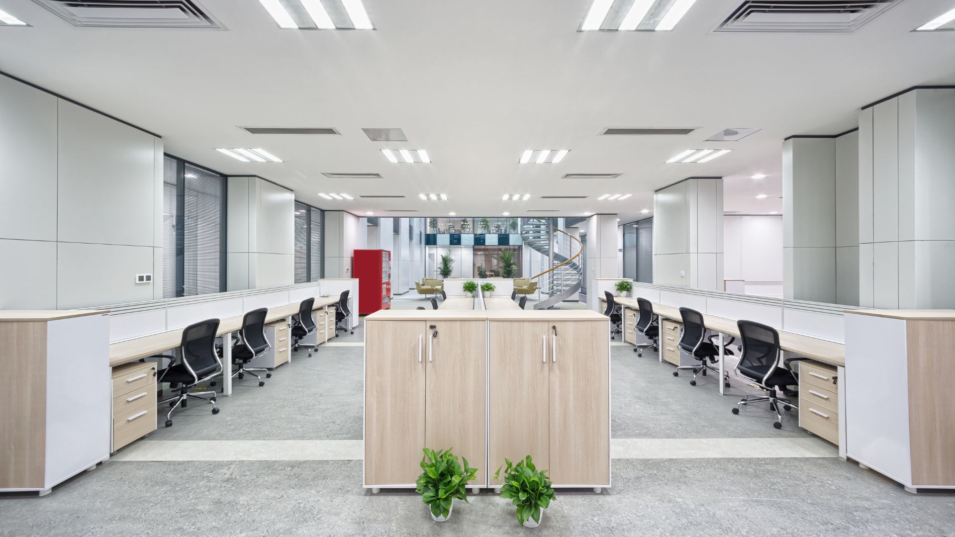 An empty office with desks and chairs